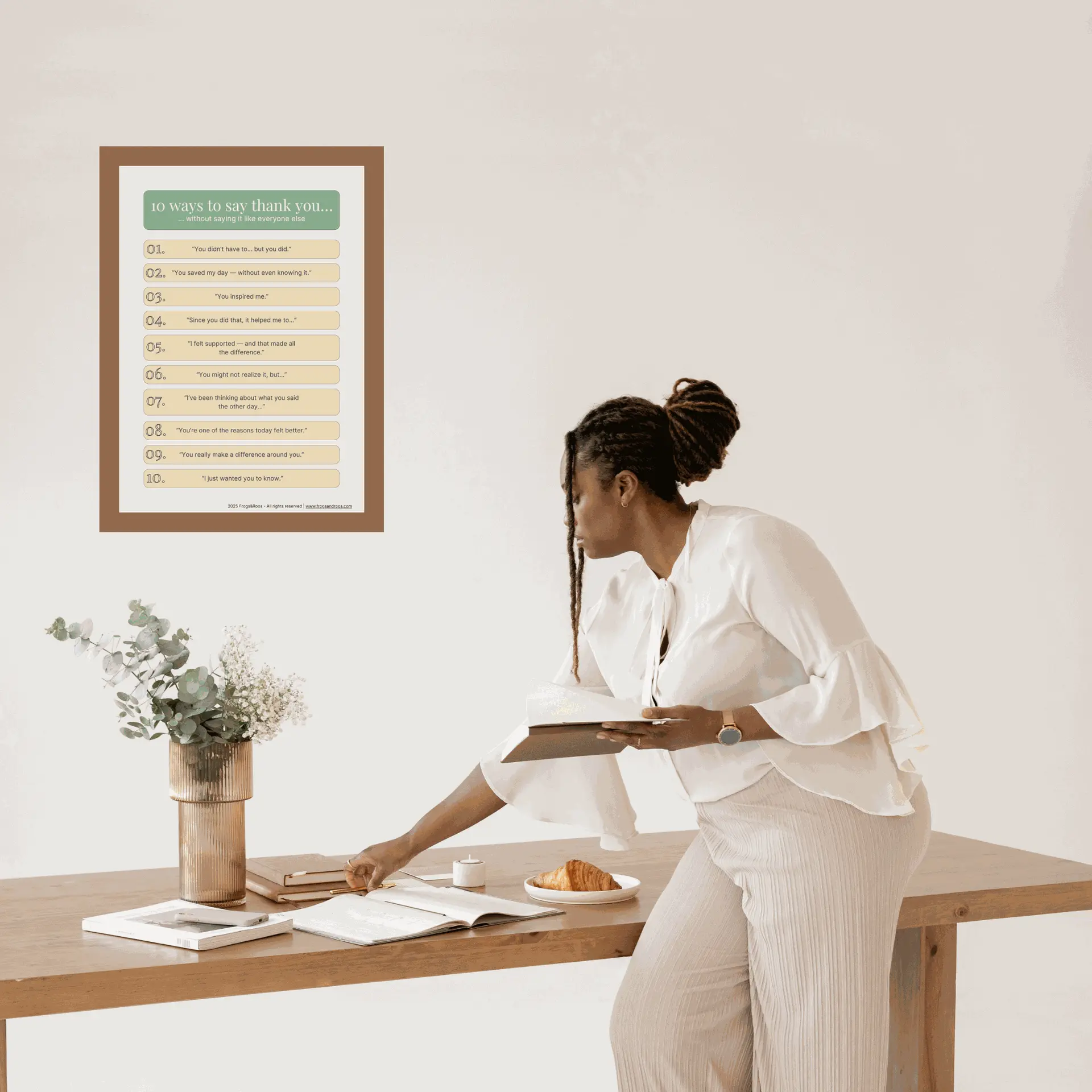 Gratitude poster titled “10 Ways to Say Thank You… Without Saying It Like Everyone Else” displayed in a minimal, elegant workspace. Designed by Frogs&Roos to promote recognition and appreciation at work.